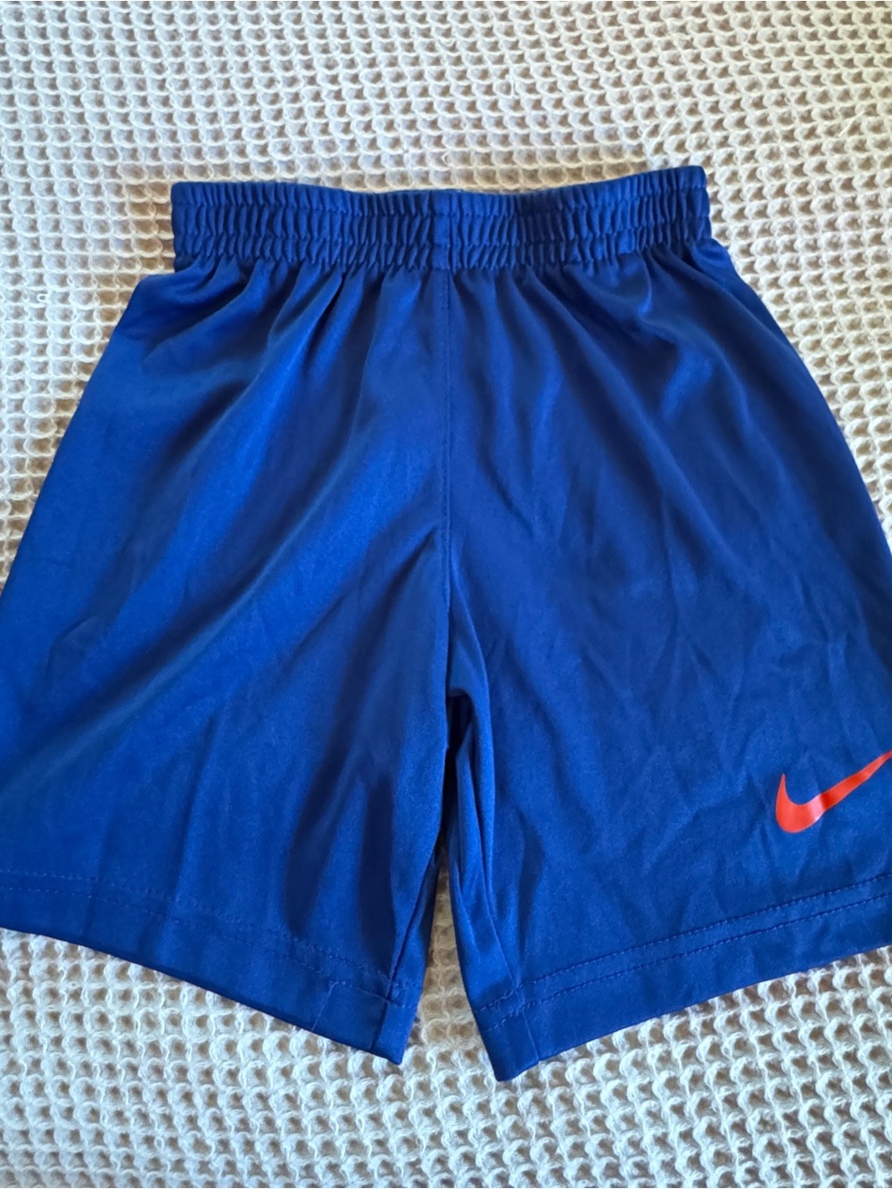 Nike Boy’s Blue Athletic Shorts with Red Swoosh